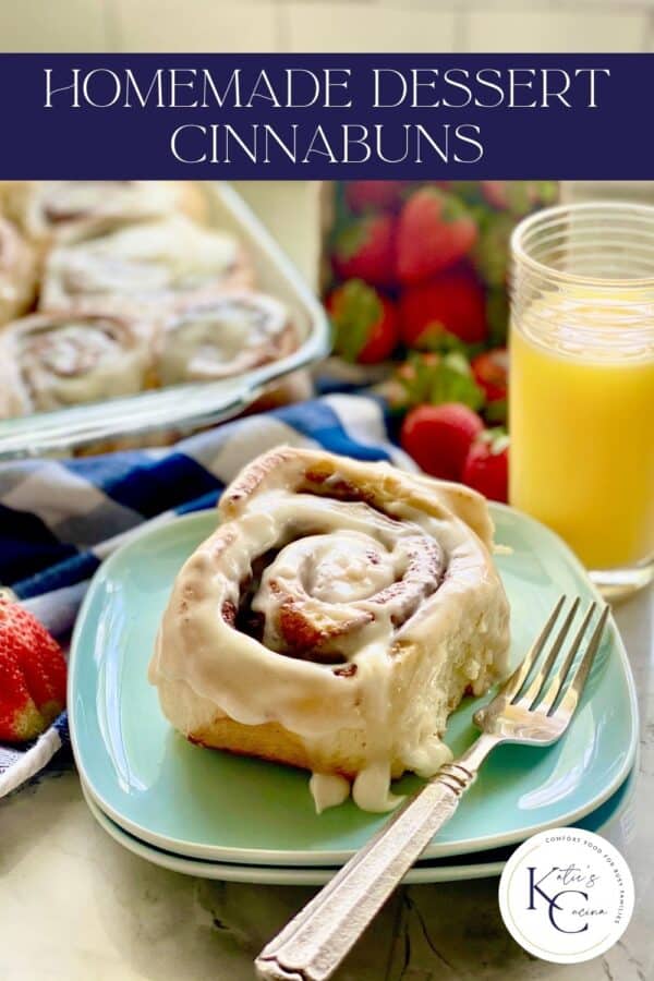 Cinnamon roll on blue plate with recipe title text on image.