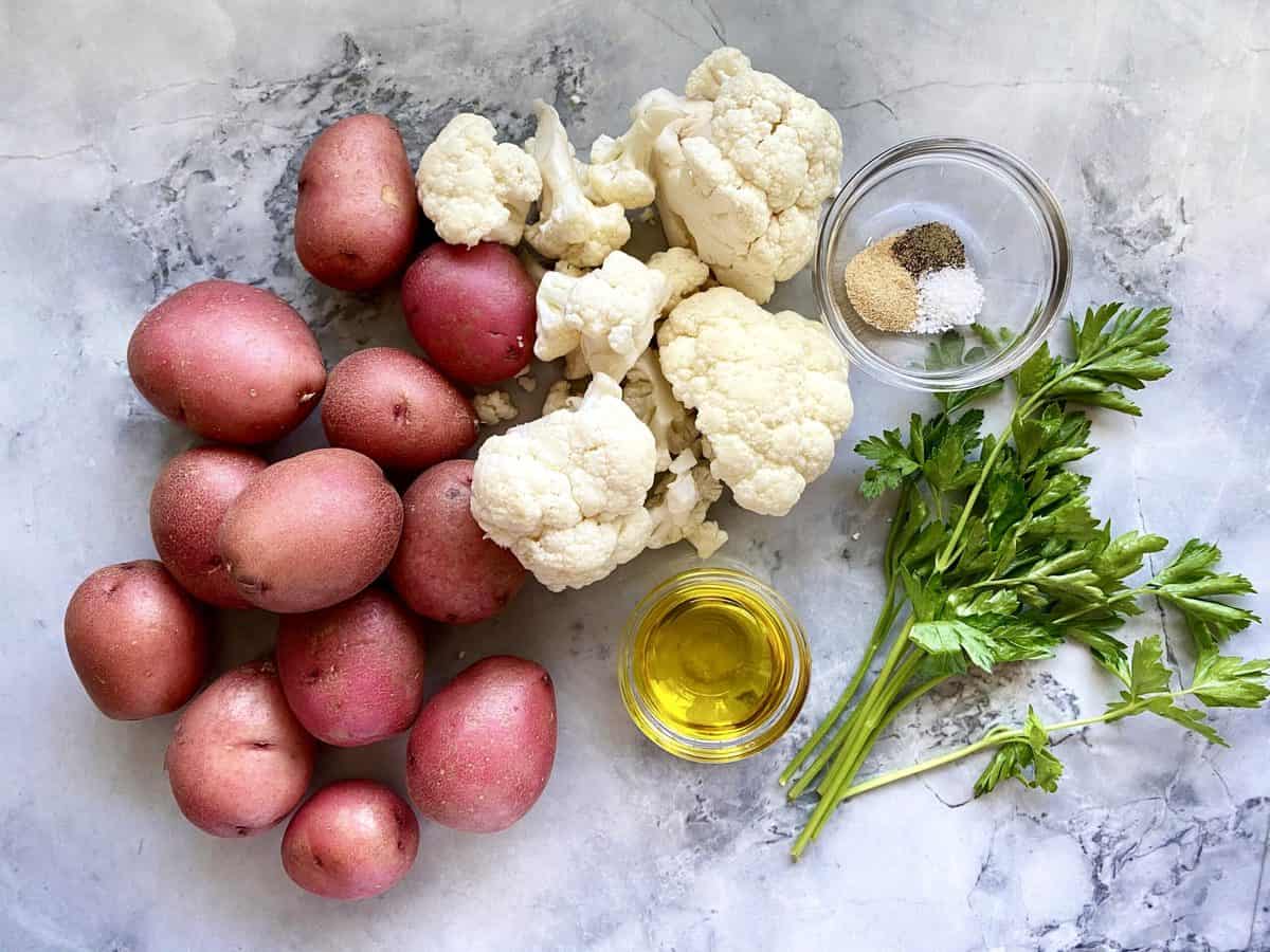 Recipe ingredients: red potatoes, cauliflower, parsley, seasonings, and oil
