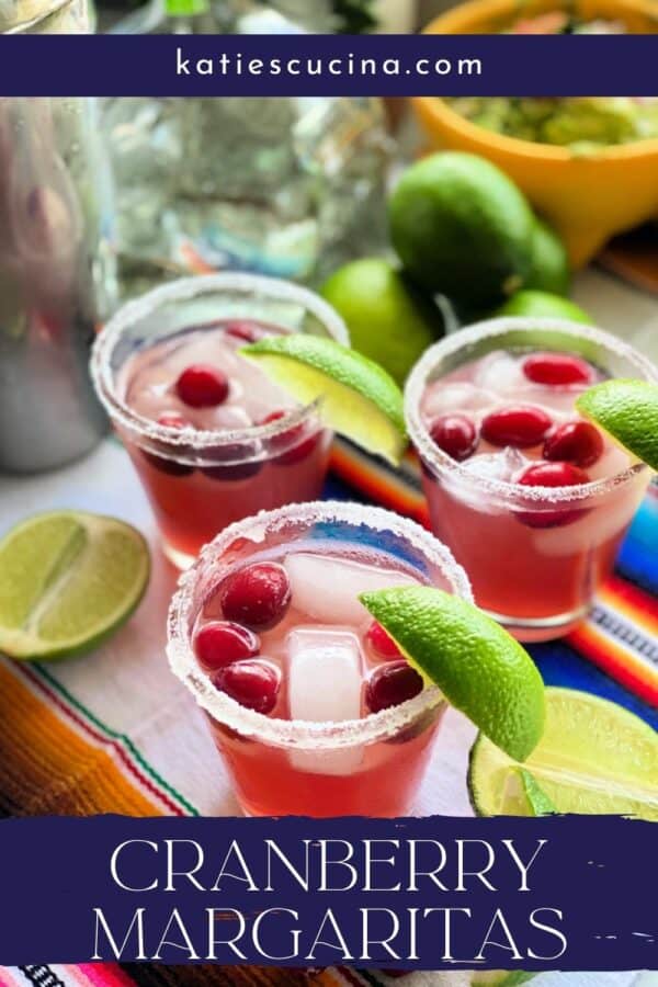 Three glasses with pink drink with sugar rim and a lime wedge.