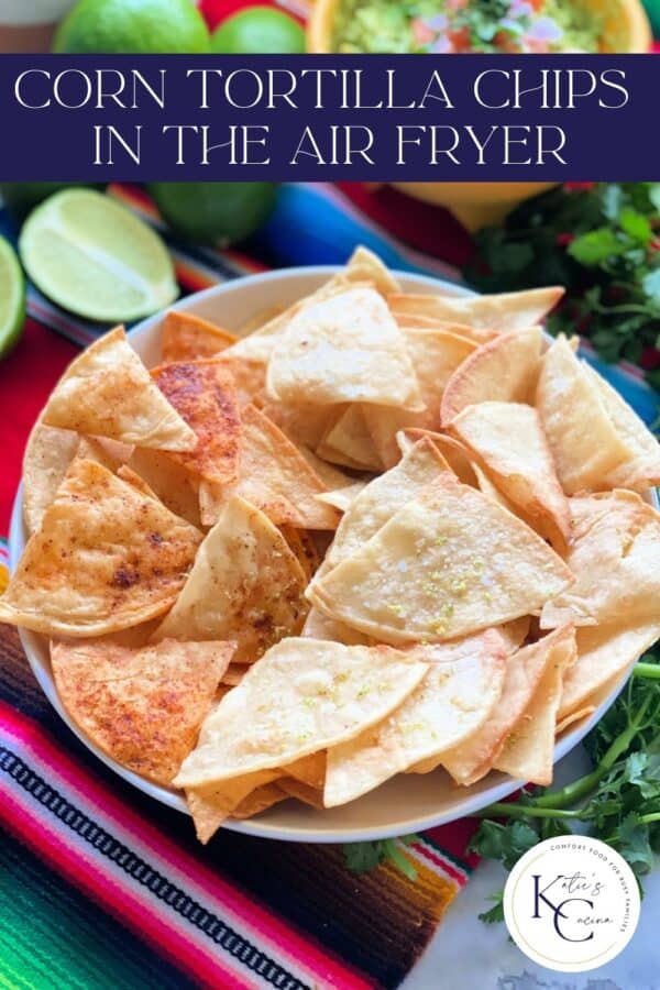 White bowl filled with tortilla chips and recipe title text on image.