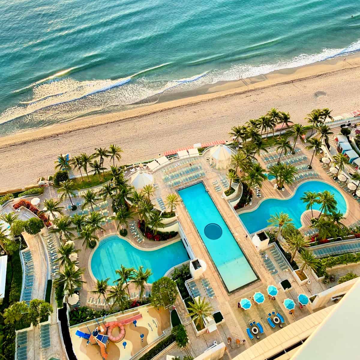 Arial view of three pools on the beach.