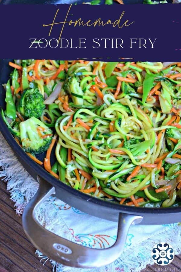 Skillet with zucchini noodles, shredded carrots and broccoli with text on image for Pinterest.