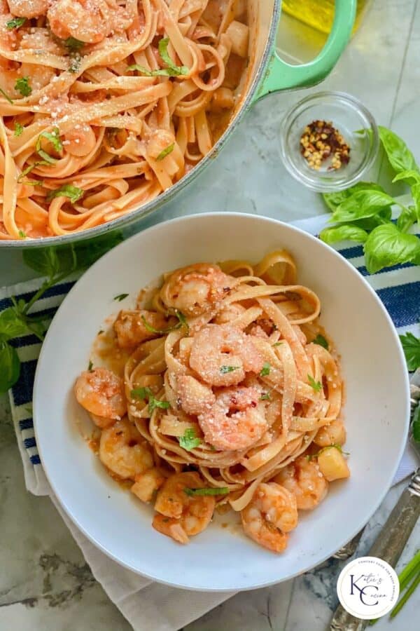 white bowl filled with shrimp pasta with watermark on image for Pinterest.