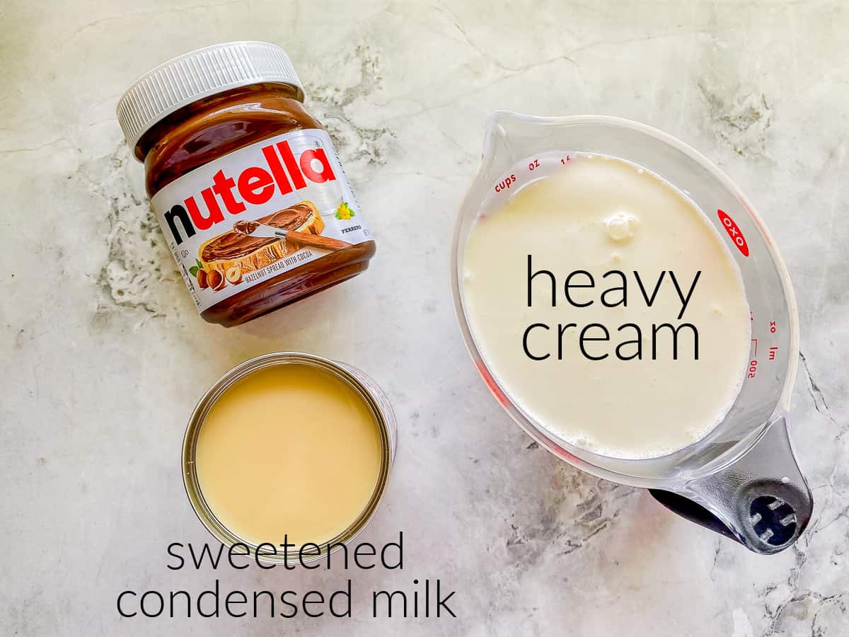 Ingredients on counter; nutella, sweetened condensed milk, and heavy cream.