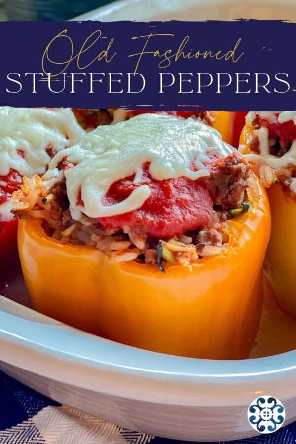 Yellow stuffed pepper topped with tomato sauce and mozzarella with recipe title text on image for Pinterest.
