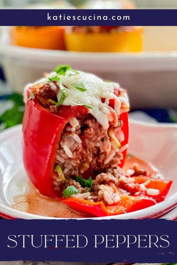 Red bell pepper cut and exposing meat and rice with recipe title text on image for pinterest.
