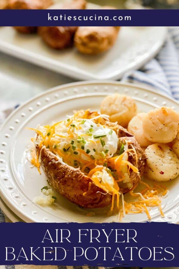White plate with a loaded baked potato and scallops with recipe title text on image for Pinterest.