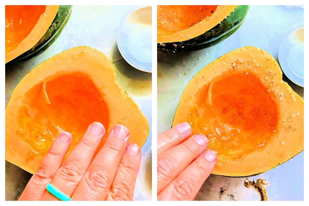 Hand massaging oil and spices over split acorn squash.