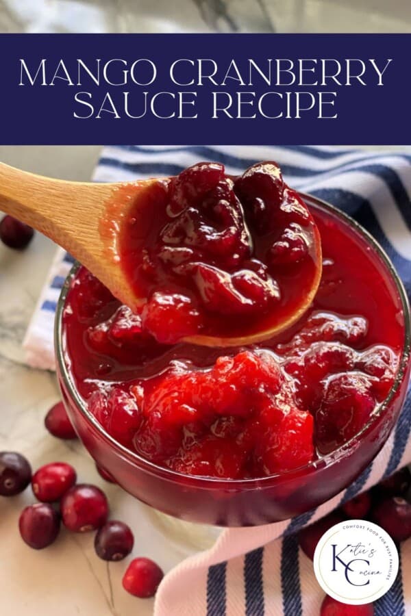 Cranberry sauce in a glass bowl with a wooden spoon scooping some out with recipe title text on image for Pinterest.