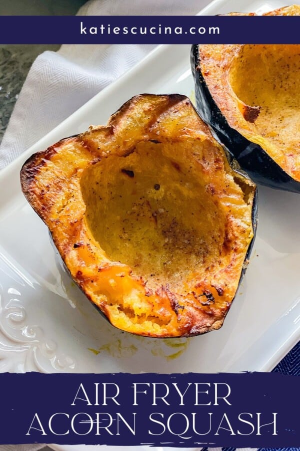 White platter with cooked acorn squash with recipe title text on image for Pinterest.