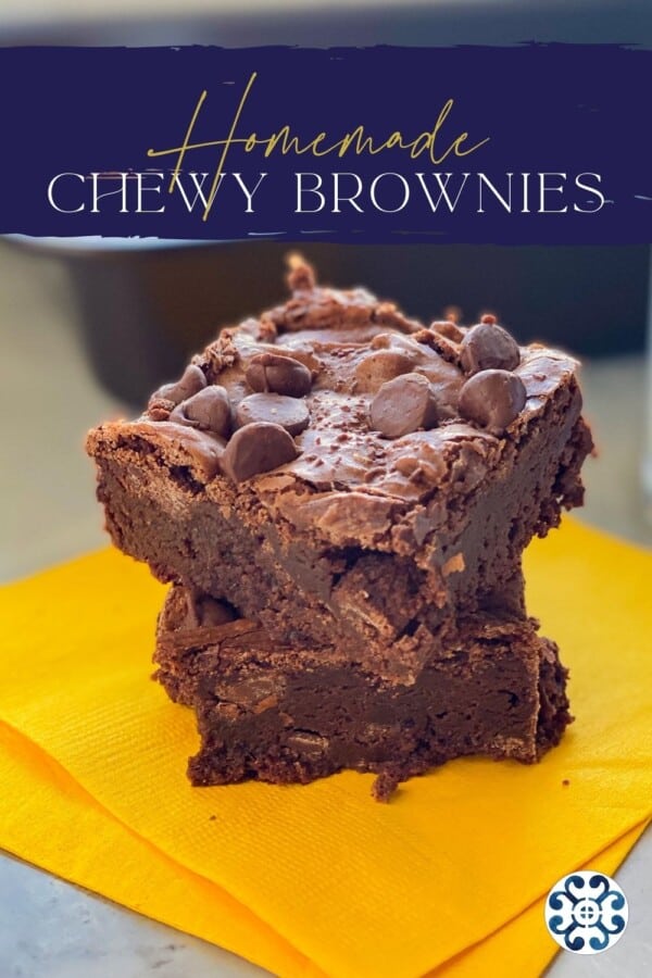 Two brownies stacked on top of yellow napkins with text on image for Pinterest.