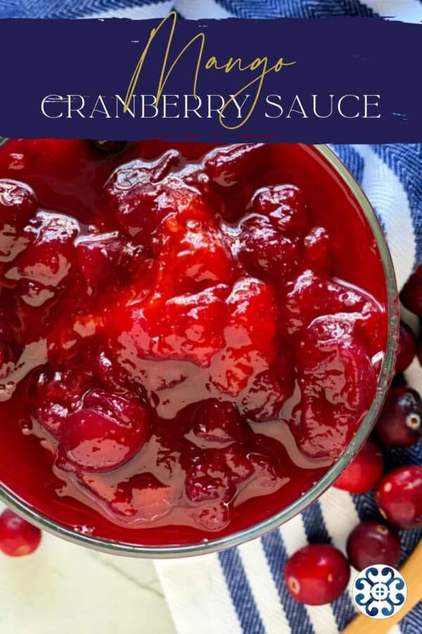 cranberry sauce with mangoes in a glass bowl with recipe title text on image for Pinterest.