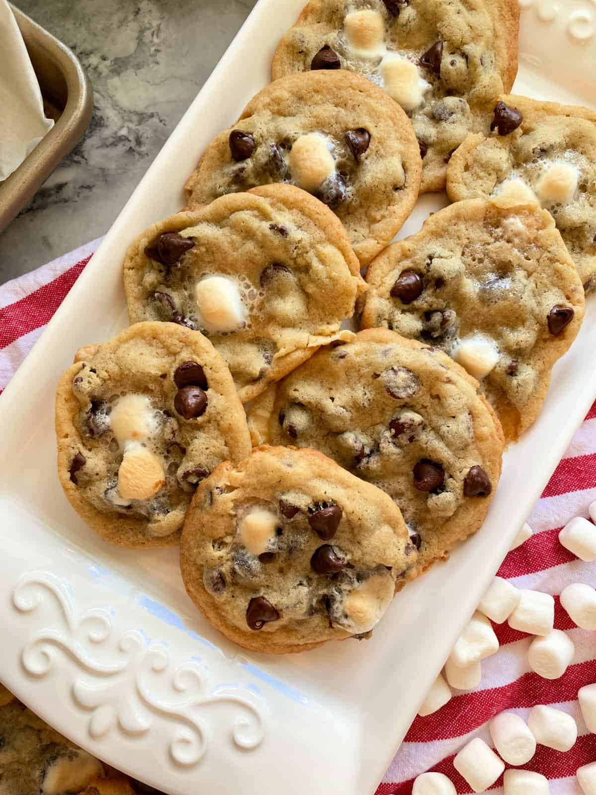 White platter filled with 8 marshmallow chocolate chip cookies.