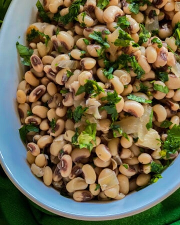 White oval dish filled with black eyed peas.