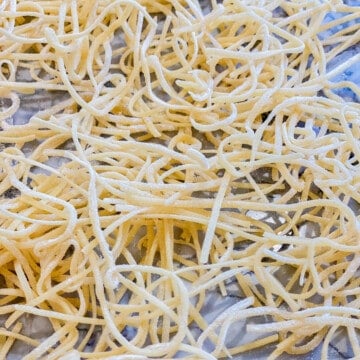 Dried spaghetti on a countertop.