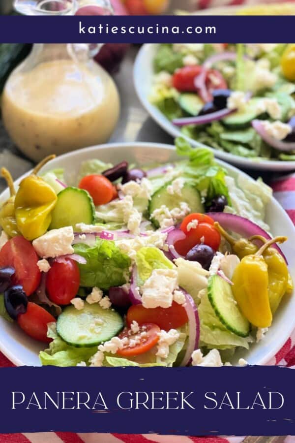 Greek salad in bowls with recipe text on image for Pinterest.