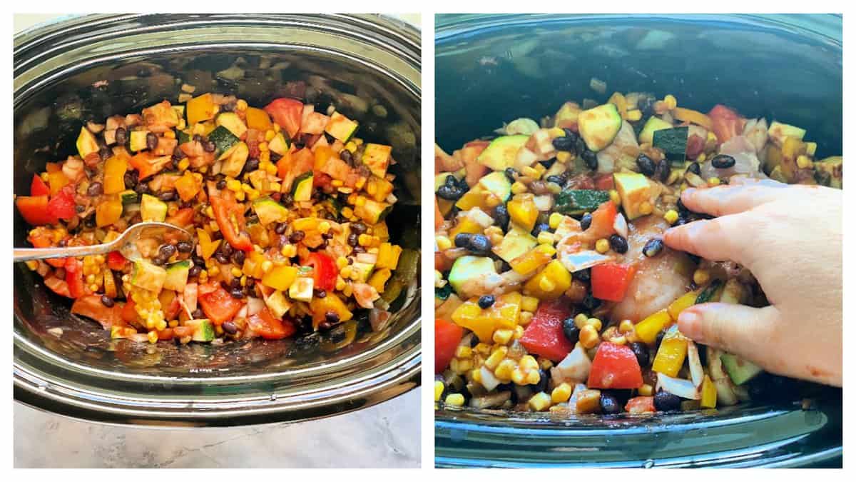 Black oval slow cooker with corn, black beans, peppers, and zucchini to the right: hand placing chicken in with the vegetables.