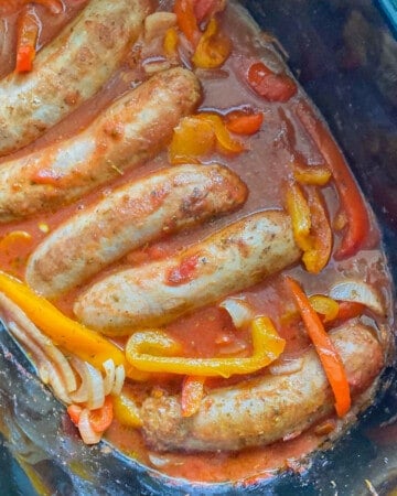 Photo taken from a vertical top angle of the Italian Sausage and Peppers being cooked inside of an instant pot.