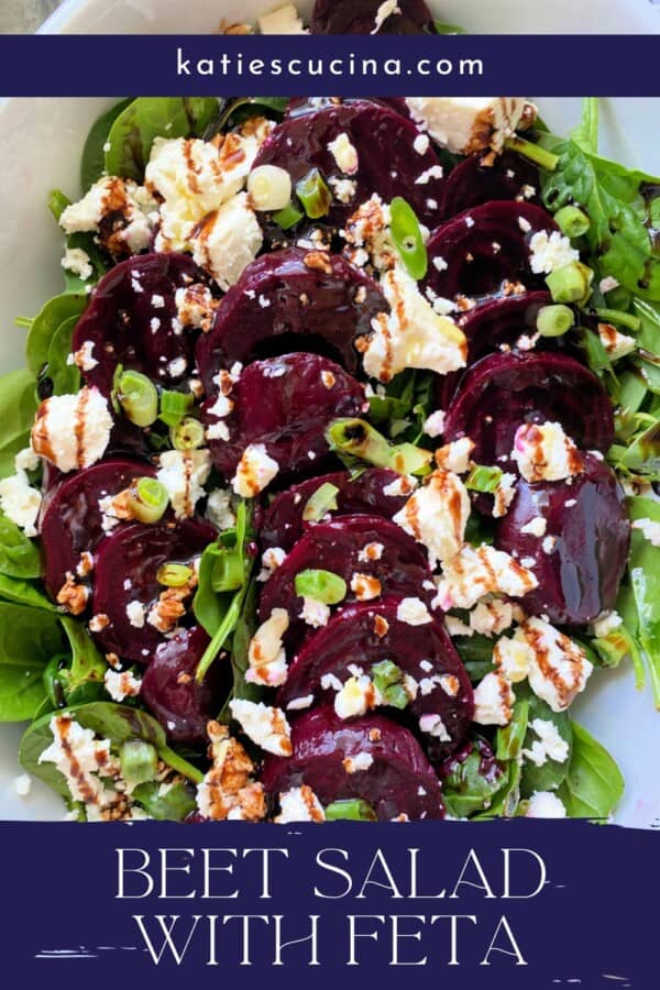 Spinach, green onions, beets, and feta in a white bowl with recipe title text on image for Pinterest.