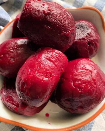 White bowl filled with cooked beets.