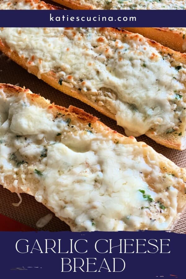 Two slices of cheese bread on a tray with text on image for Pinterest.