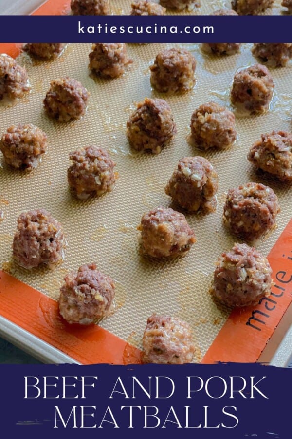 Baked meatballs on a baking tray with title text on image for pinterest.
