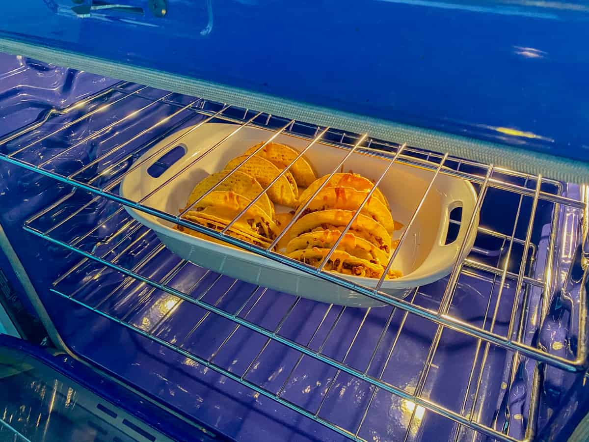 Beef Tacos in a baking dish baking in an oven