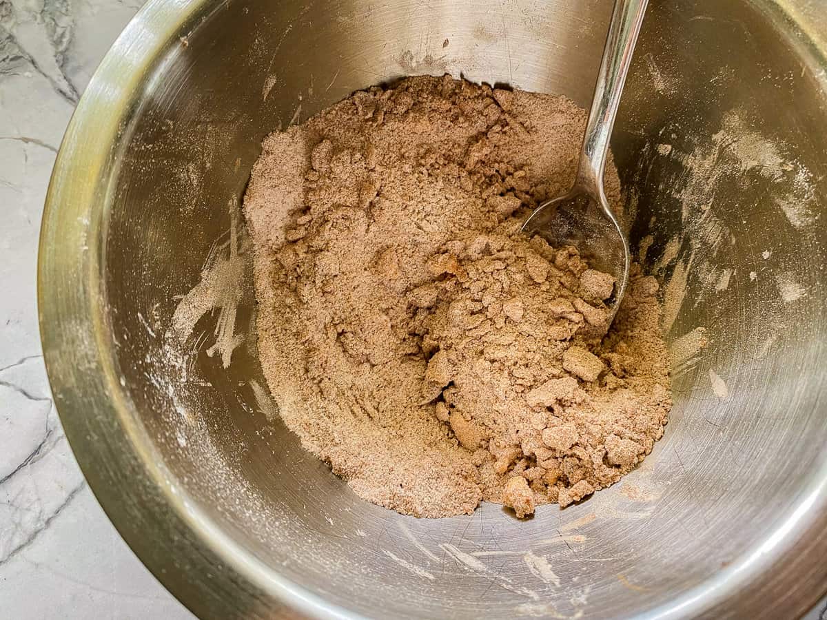 Crumb toppings being mixed in a mixing bowl.