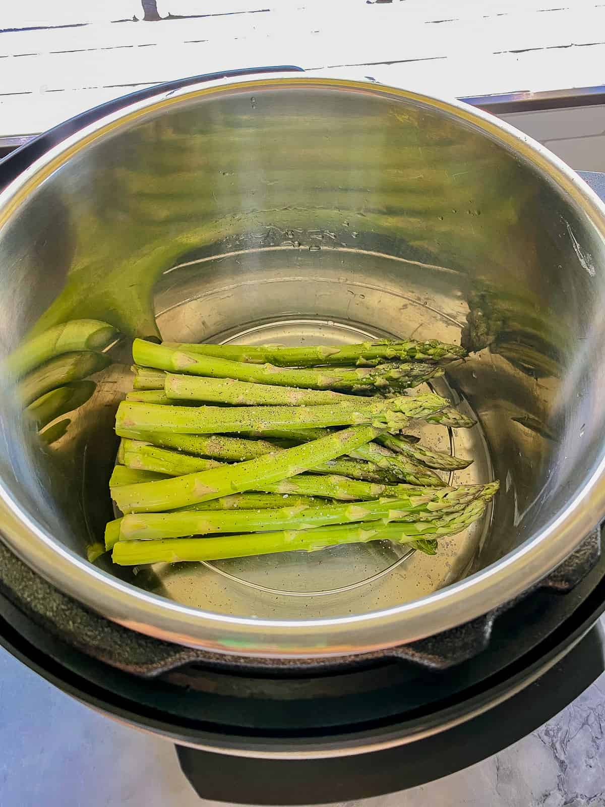 Asparagus resting in an Instant pot.