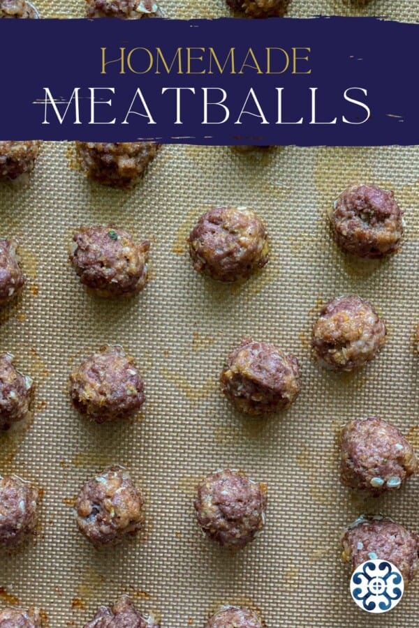 Rows of cooked meatballs on a silicone tray with title text on image for pinterest.