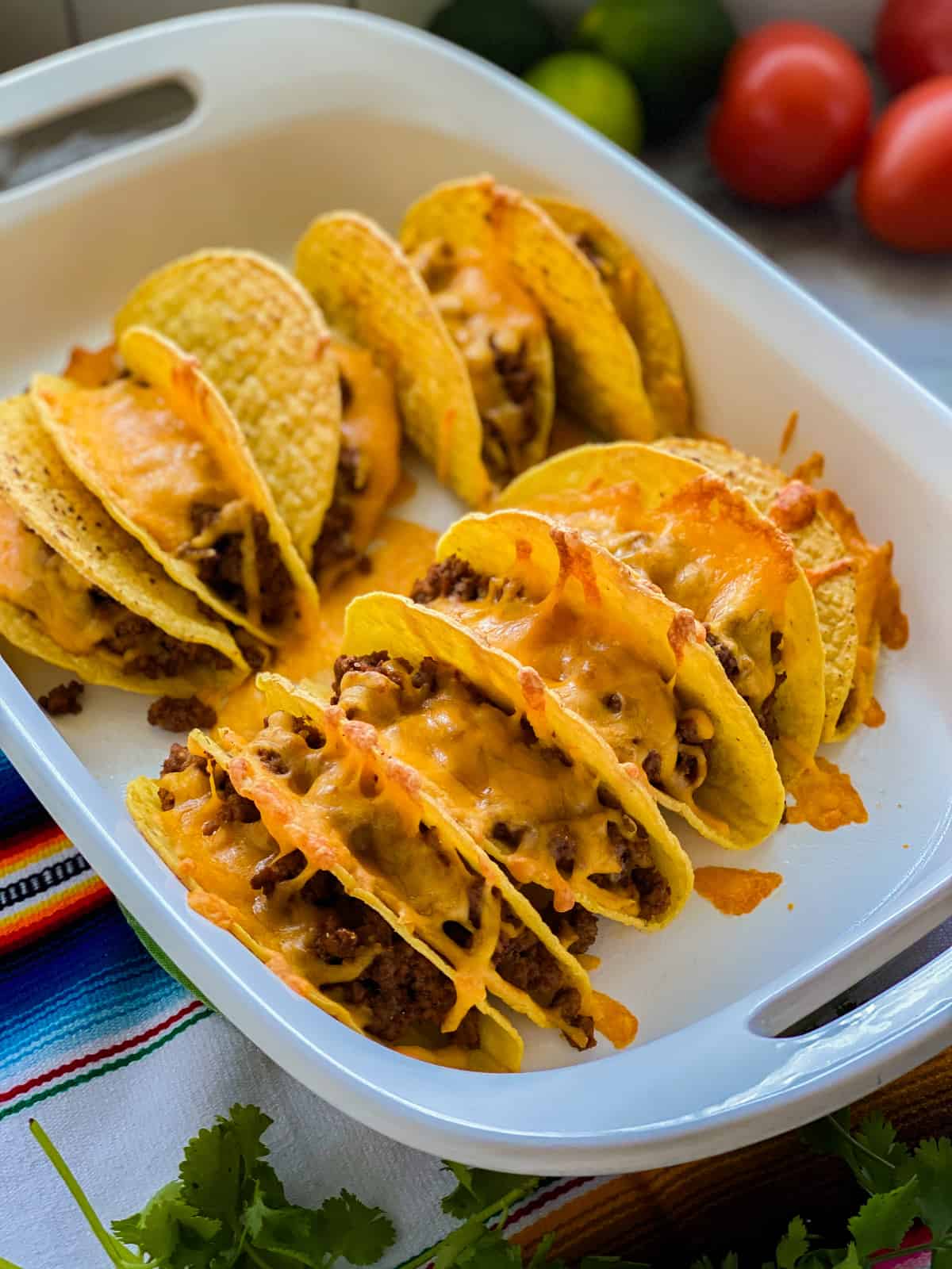 Portrait of beef tacos in a baking dish.