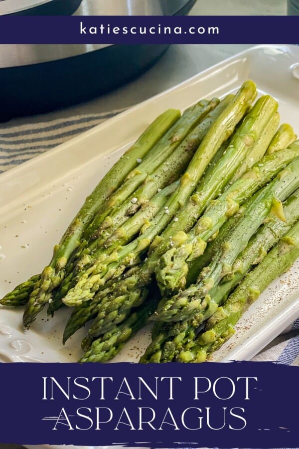 Cooked asparagus laying on a white dish with a katiescucina.com header and the title "Instant Pot Asparagus" on the bottom.