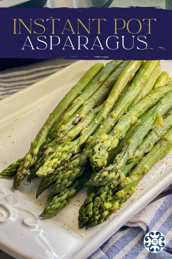 Cooked asparagus resting on a serving dish with the title "Instant Pot Asparagus" at the top.
