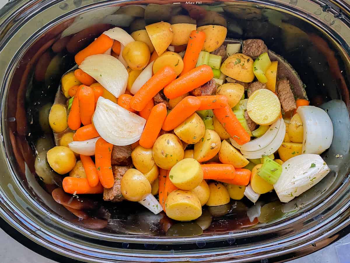 Slow Cooker beef ingredients resting in the instant pot.