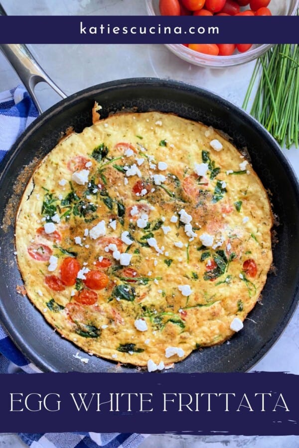 Black frying pan with egg frittata with goat cheese on top with text on image for Pinterest.