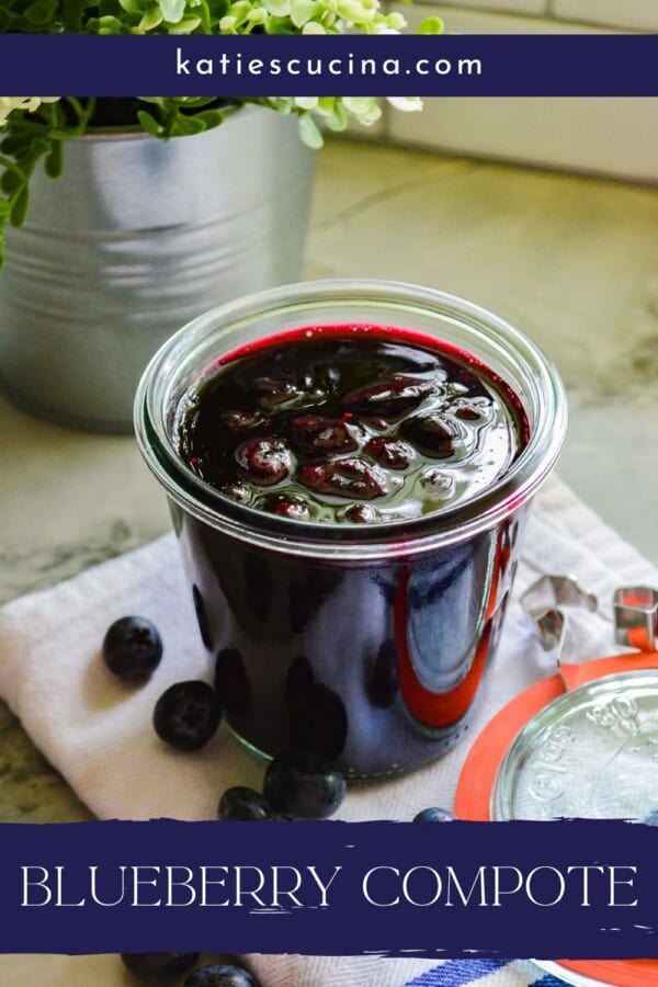 Glass jar with lid next to it filled with blueberry compote and fresh blueberries on the side with recipe title text on image.