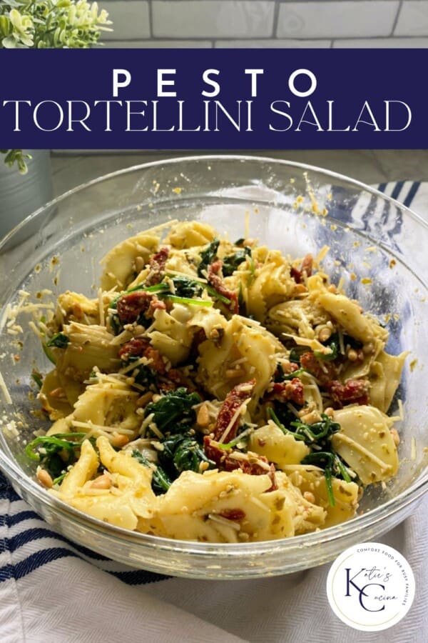 Glass bowl filled with tortellini salad with recipe title text on image for Pinterest.