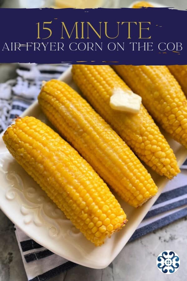 Text on image: "15 minute air fryer corn on the cob" with photo of 5 corn on the cobs on a long white dish with a pad of butter on top