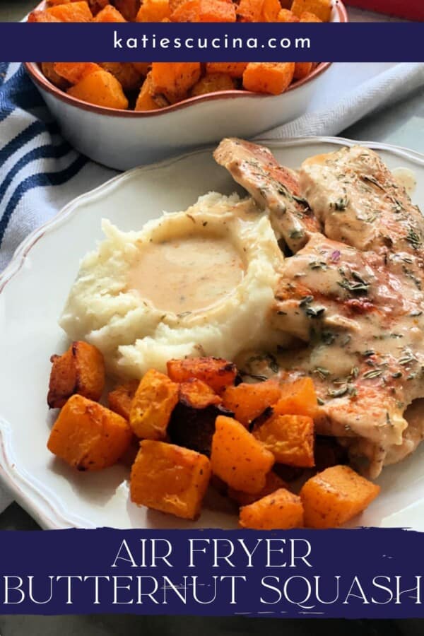 Text on image: "air fryer butternut squash" with photo of plate with mashed potatoes, turkey cutlets, and butternut squash and air fryer butternut squash in a dish on a blue and white striped cloth.