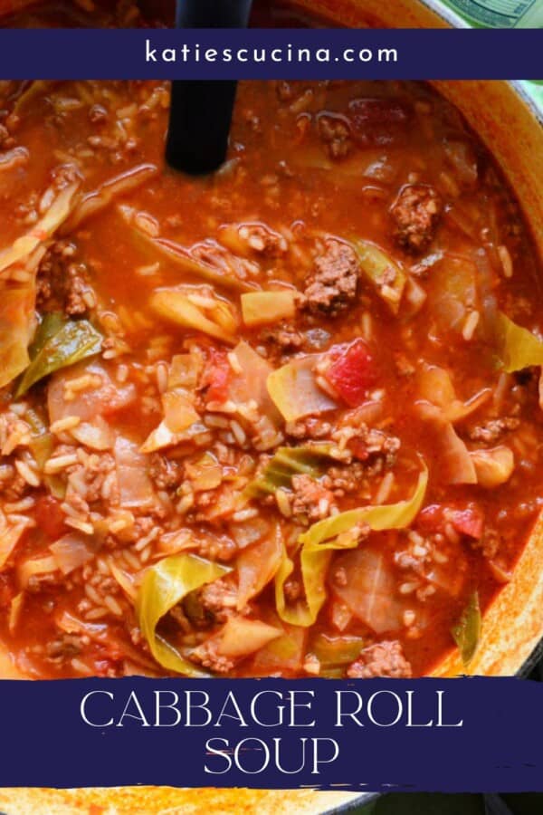 text on image: "cabbage roll soup" a pot full of cabbage soup on green fabric and a ladle.