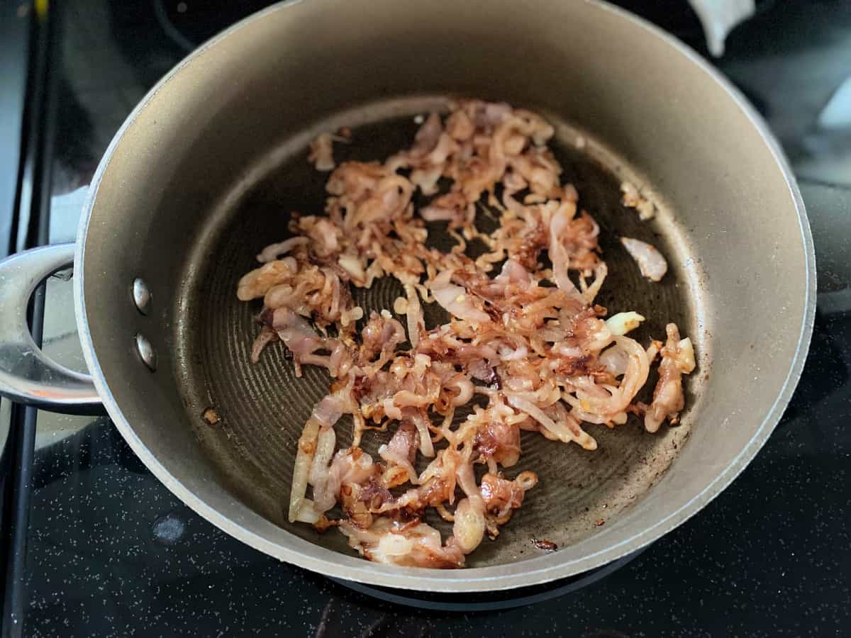 Caramelized shallots in a skillet.