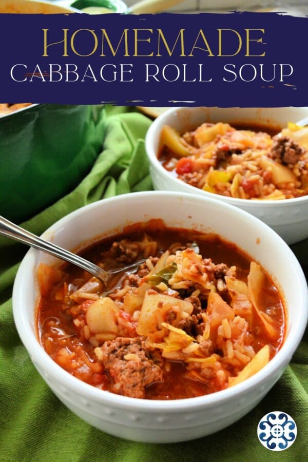 text on image: "homemade cabbage roll soup" with photo of two white bowls with stuffed cabbage soup on green fabric with a pot of soup and slices of bread in the background.