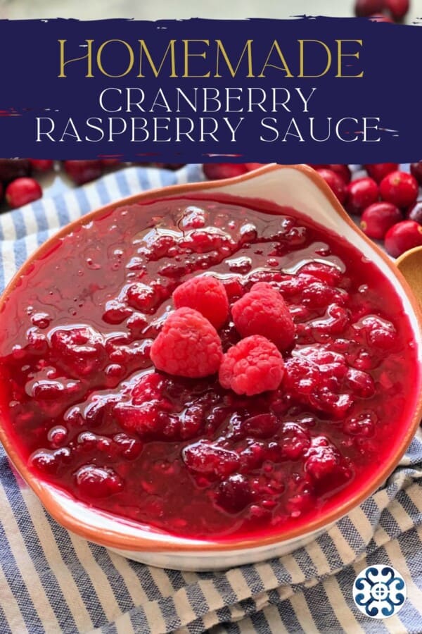Text on image: "homemade cranberry raspberry sauce" with photo of Cranberry raspberry sauce in a bowl on a blue and white stripped cloth with cranberries scattered in the background.