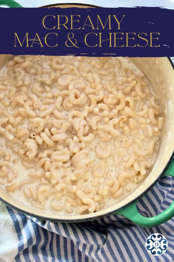 White pot filled with elbow macaroni and cheese with text on image for Pinterest.
