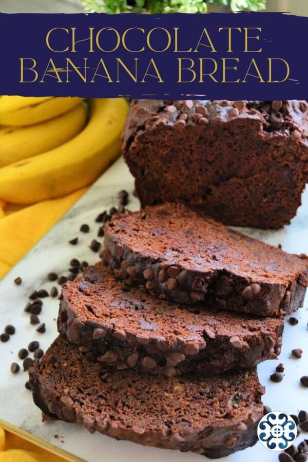Loaf of chocolate bread with 3 slices on a marble board with text on image for Pinterest.