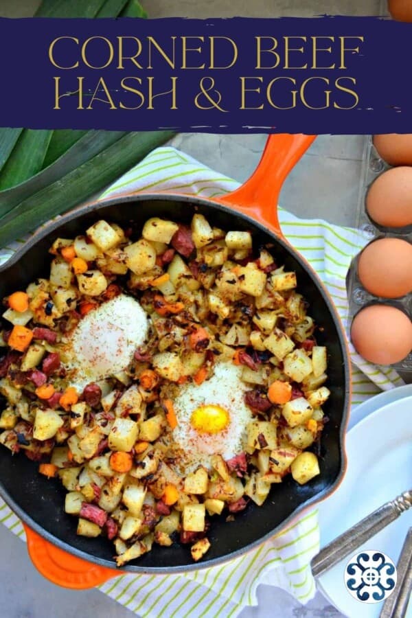Orange skilled filled with corned beef hash and eggs with text on image for Pinterest.