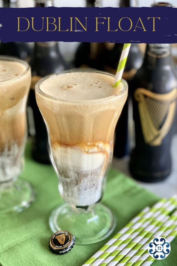 Two glasses filled with ice cream floats with Guinness bottles in the background with text on image for Pinterest.