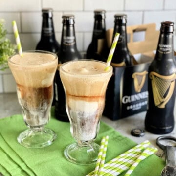 Two glasses filled with ice cream and beer.