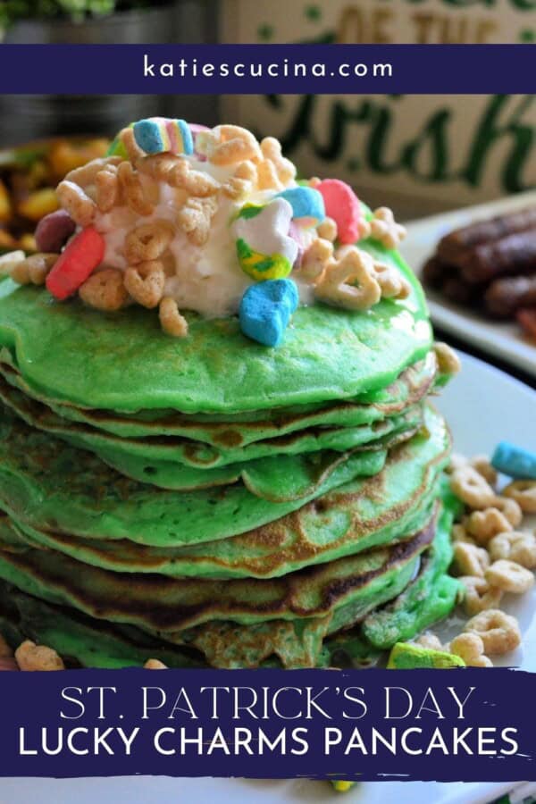 8 stacked green pancakes with whipped cream and Lucky Charms cereal on top with text on image for Pinterest.