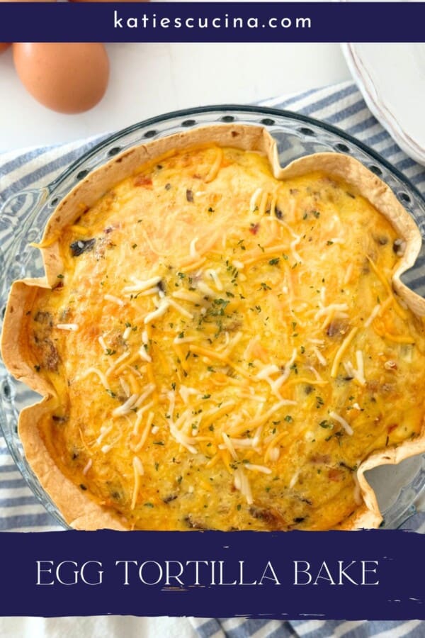 Glass bakiing dish filled with baked egg and shredded cheese with text on image for Pinterest!